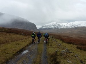 Scott, Nigel and Martin climbing the Ogwen Valley double track. 